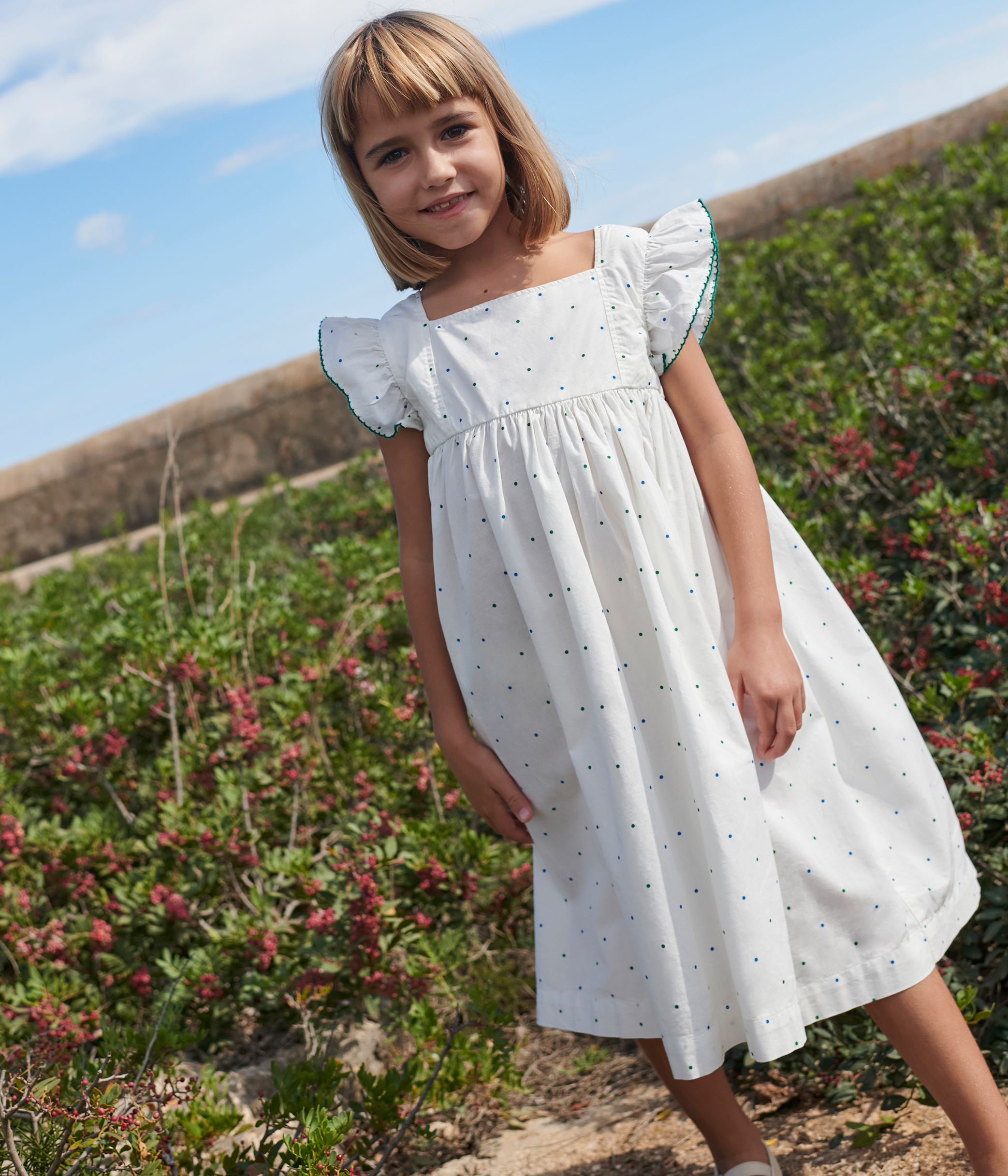 Children's long sleeveless cotton dress with spots
