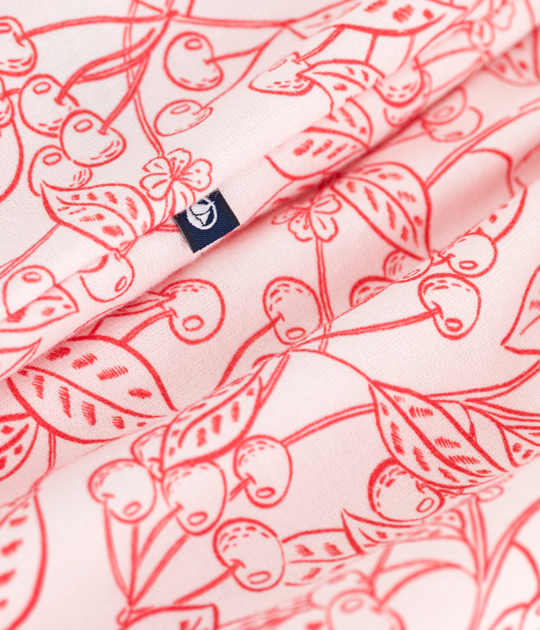 Babies' sleeveless jumpsuit in cotton with a pink cherry print