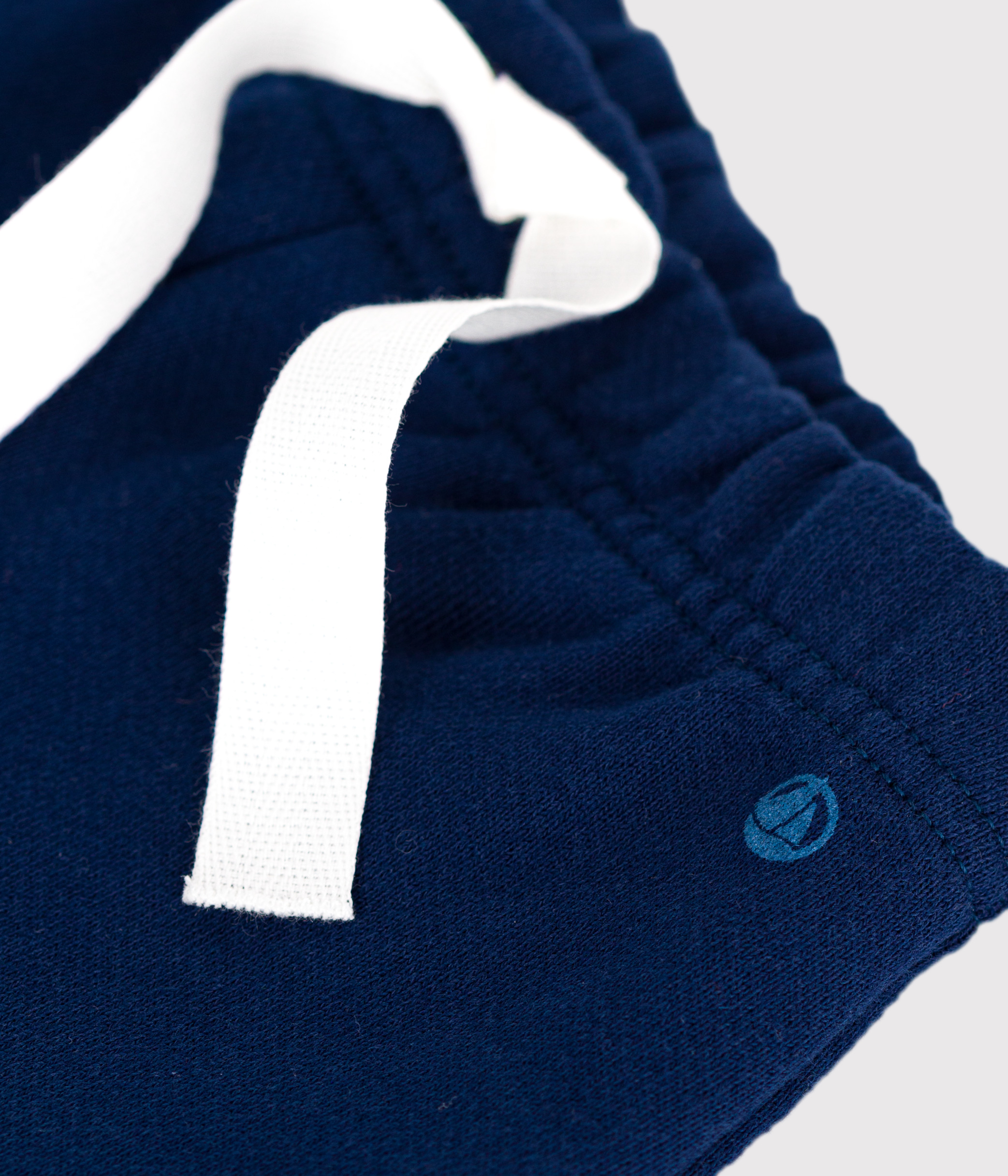 Babies' jogging bottoms in plain cotton