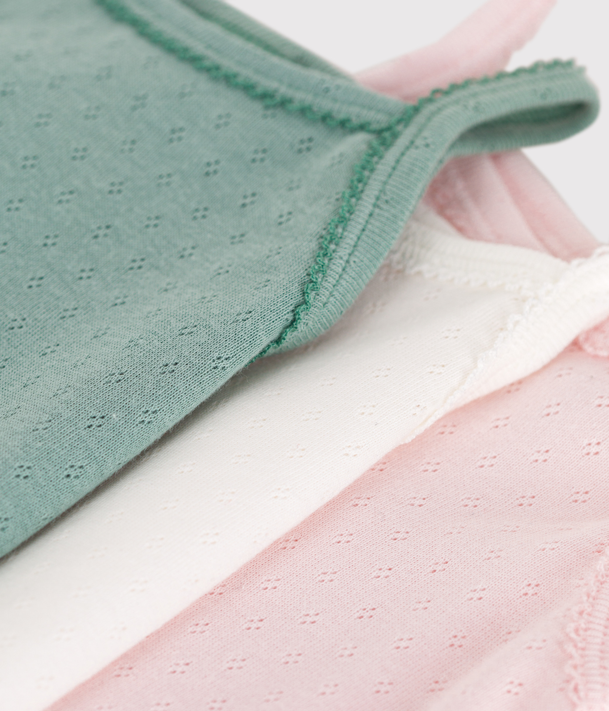 Set of 3 plain cotton baby bodysuits with straps