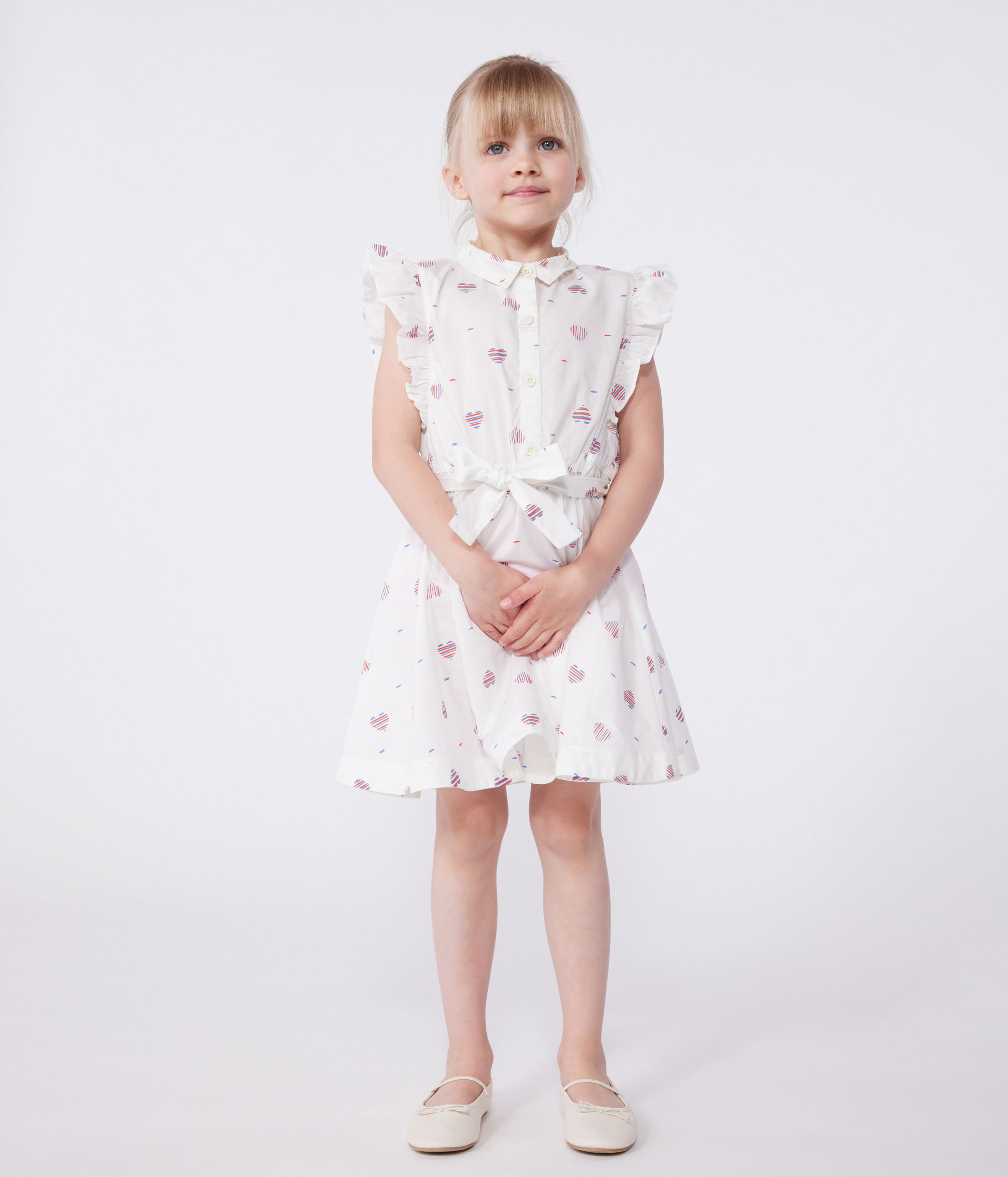 Child's sleeveless cotton dress with hearts