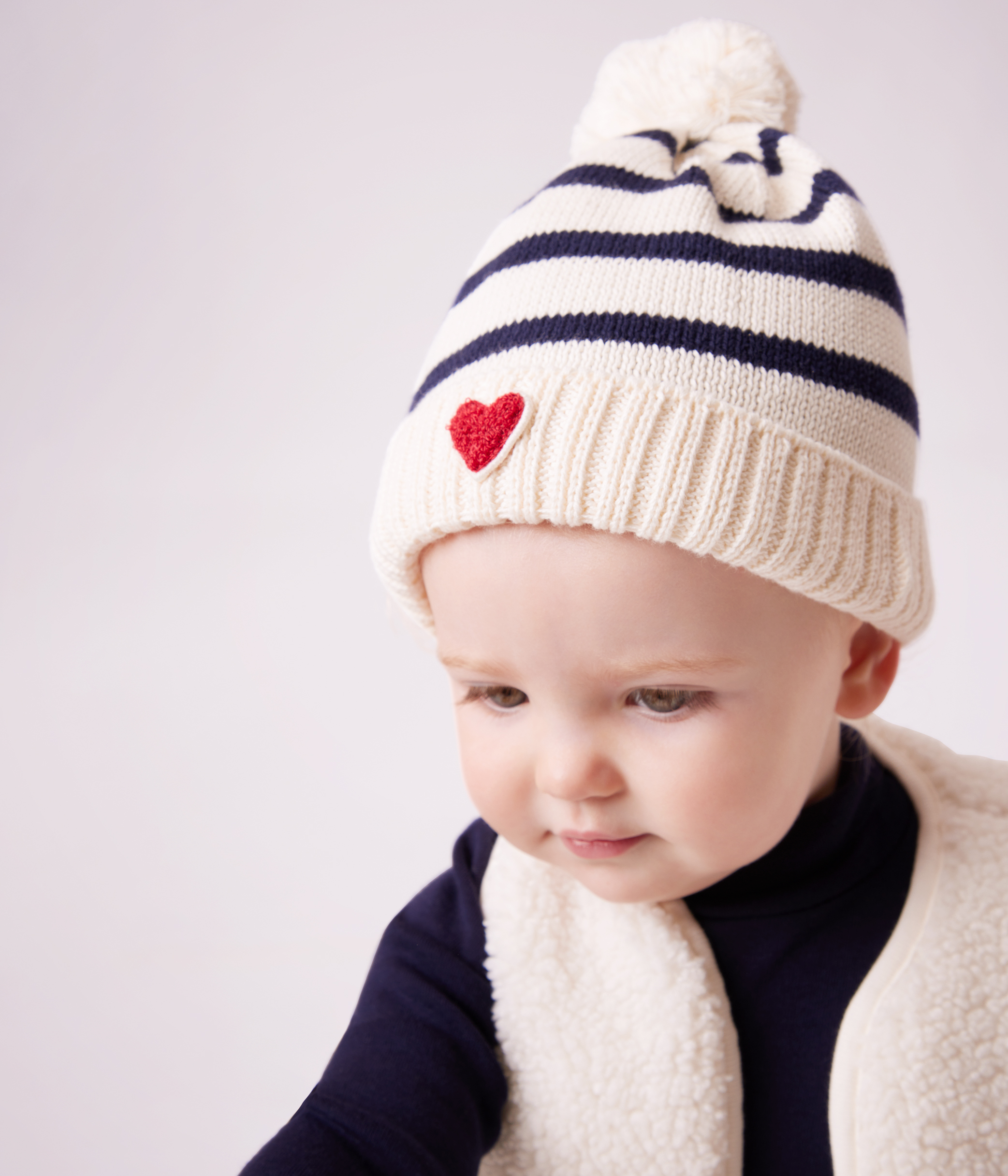 Babies' stripy knitted beanie with a fleece lining