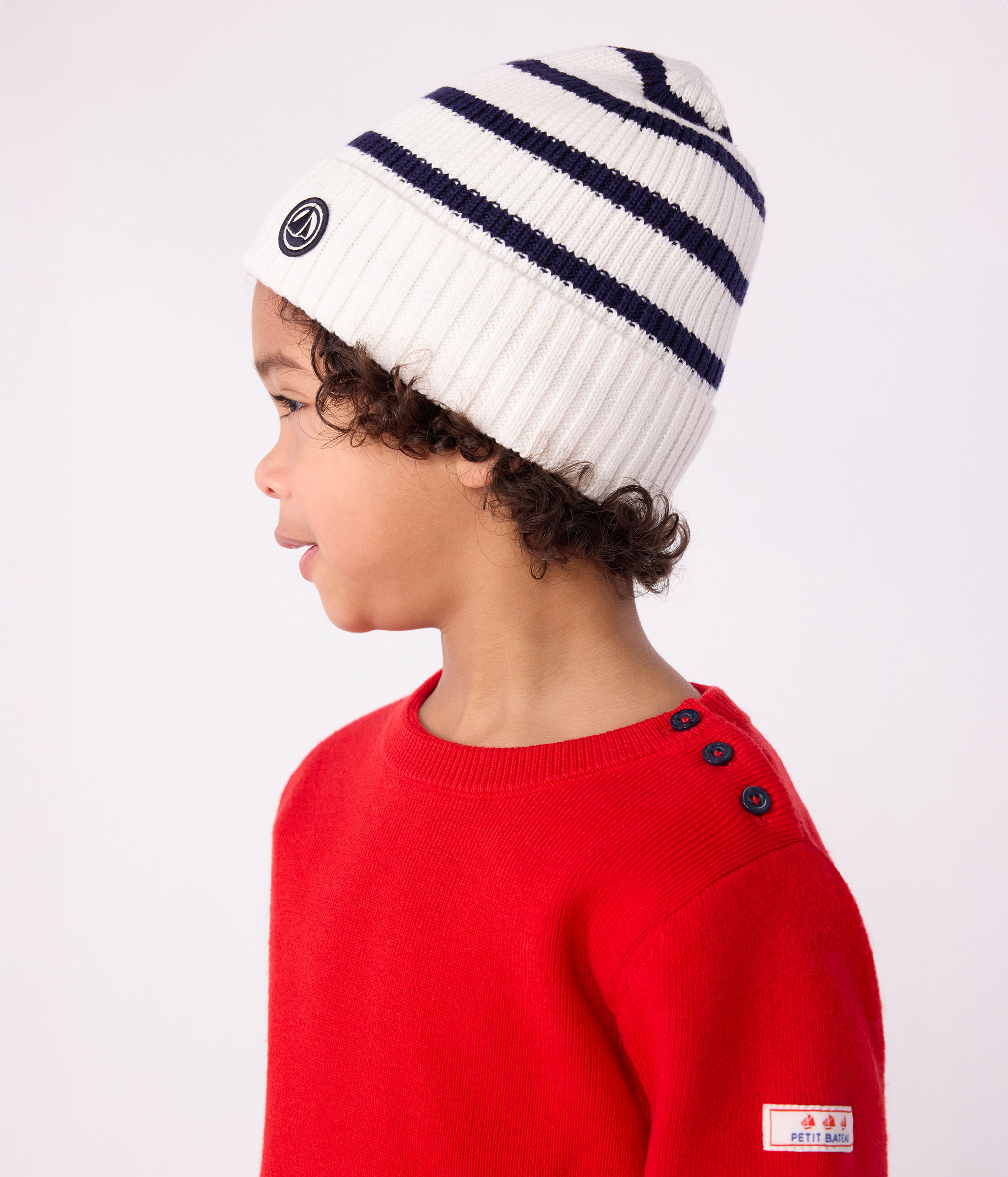 Children's stripy knitted beanie hat lined in polar fleece