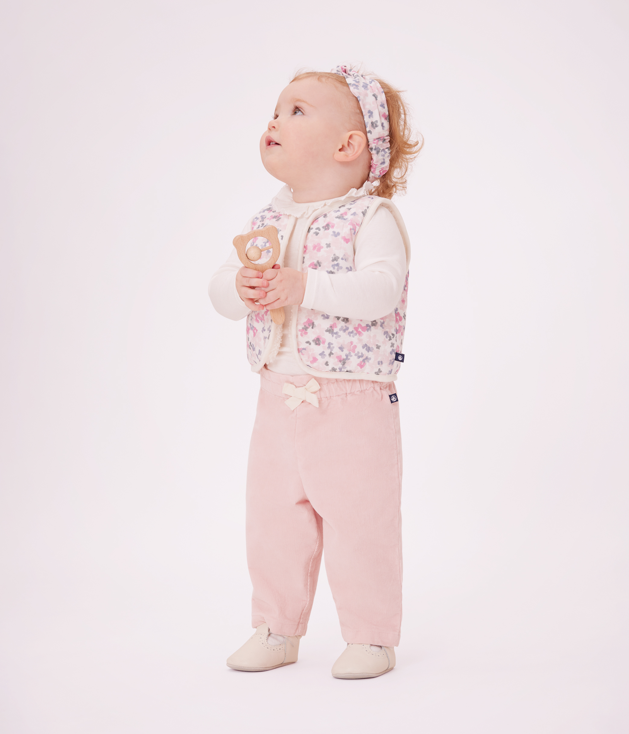 Babies' plain velour trousers with an embroidered back pocket