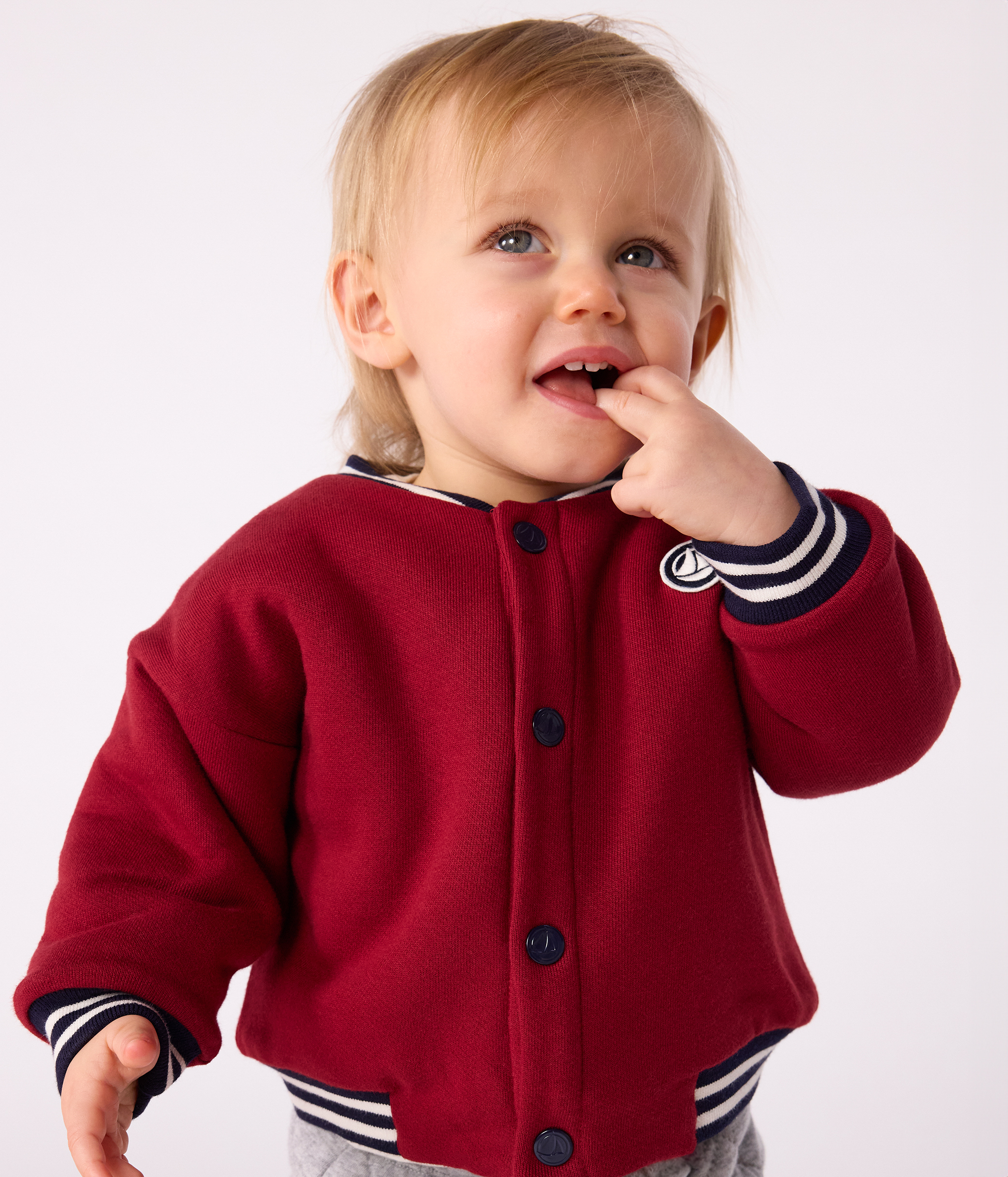 Babies' varsity-style jacket in plain cotton and sherpa
