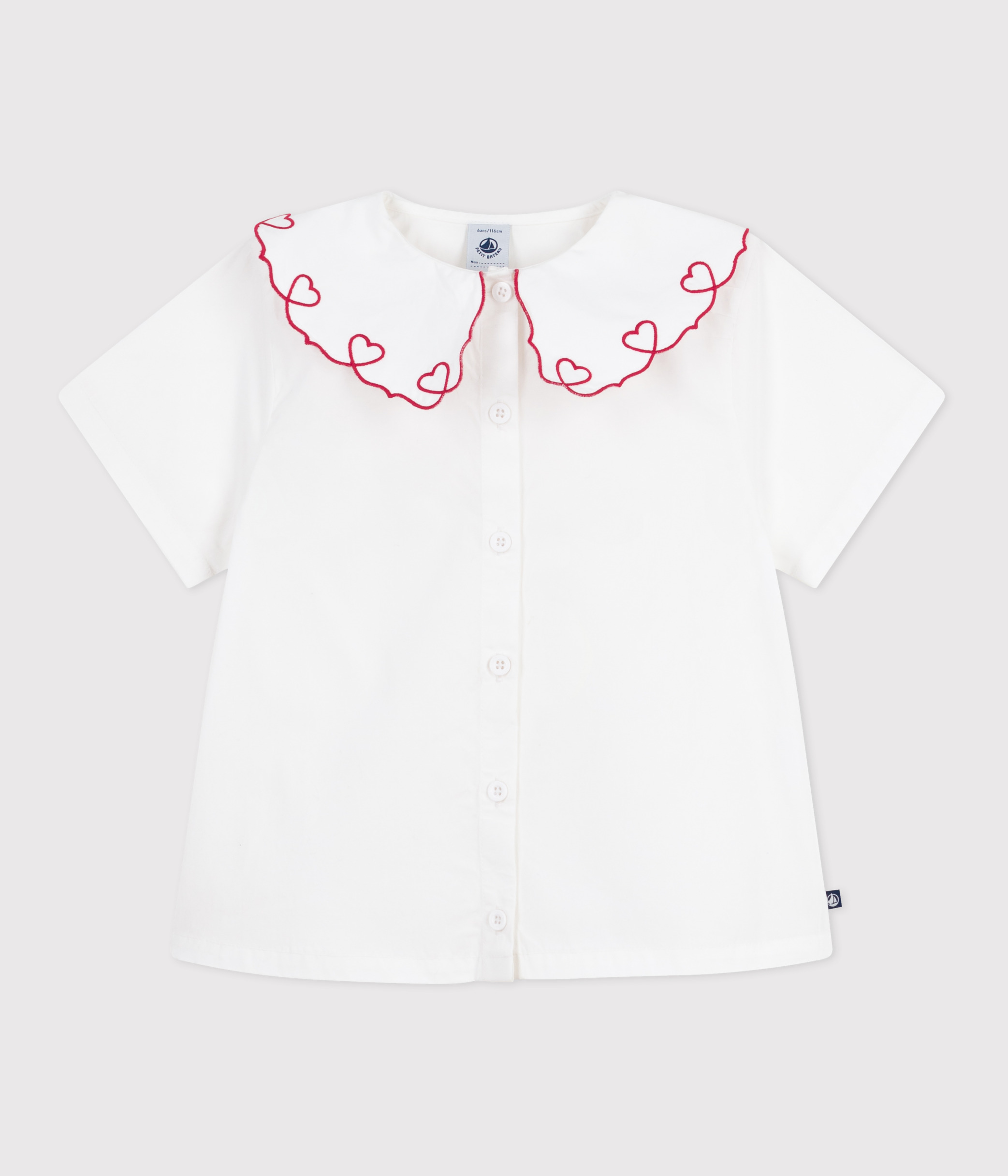 Children's short-sleeved blouse in plain cotton poplin.
