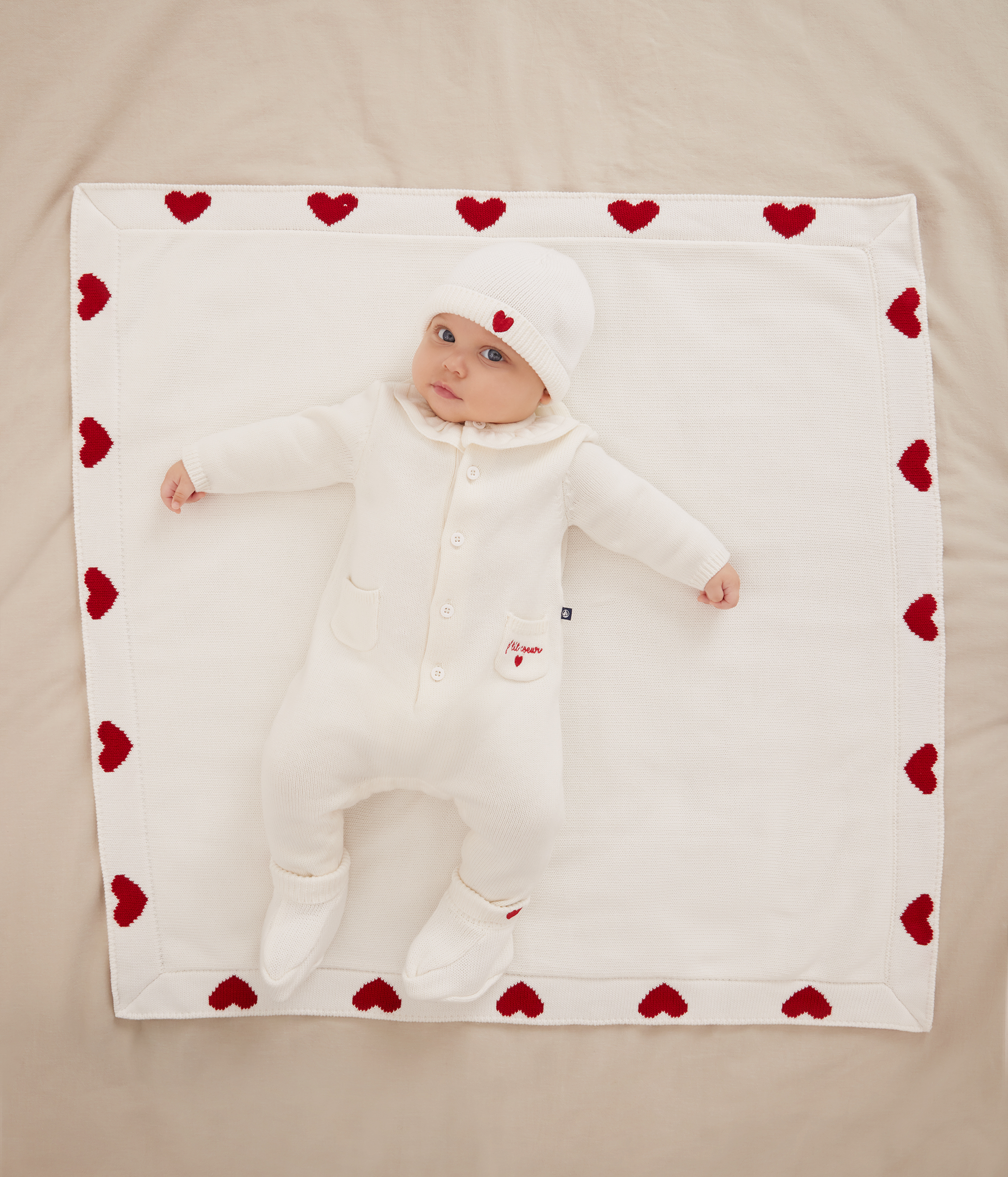 Babies' knitted playsuit with a collar and P'tit Cœur embroidery