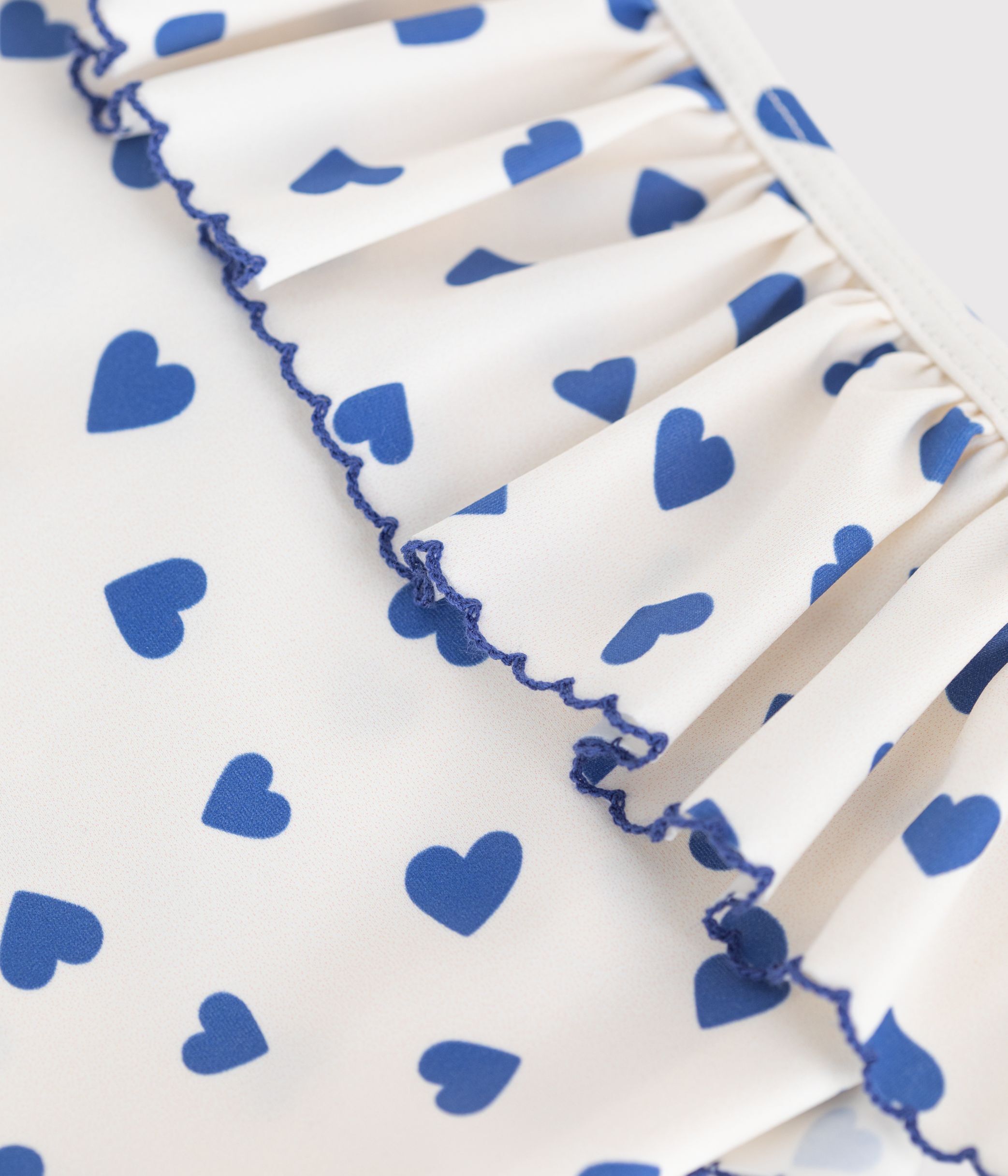 Children's one-piece heart print ruffled swimsuit.
