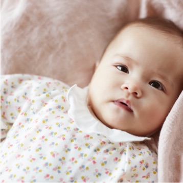 Baby image showcasing clothing by Petit Bateau
